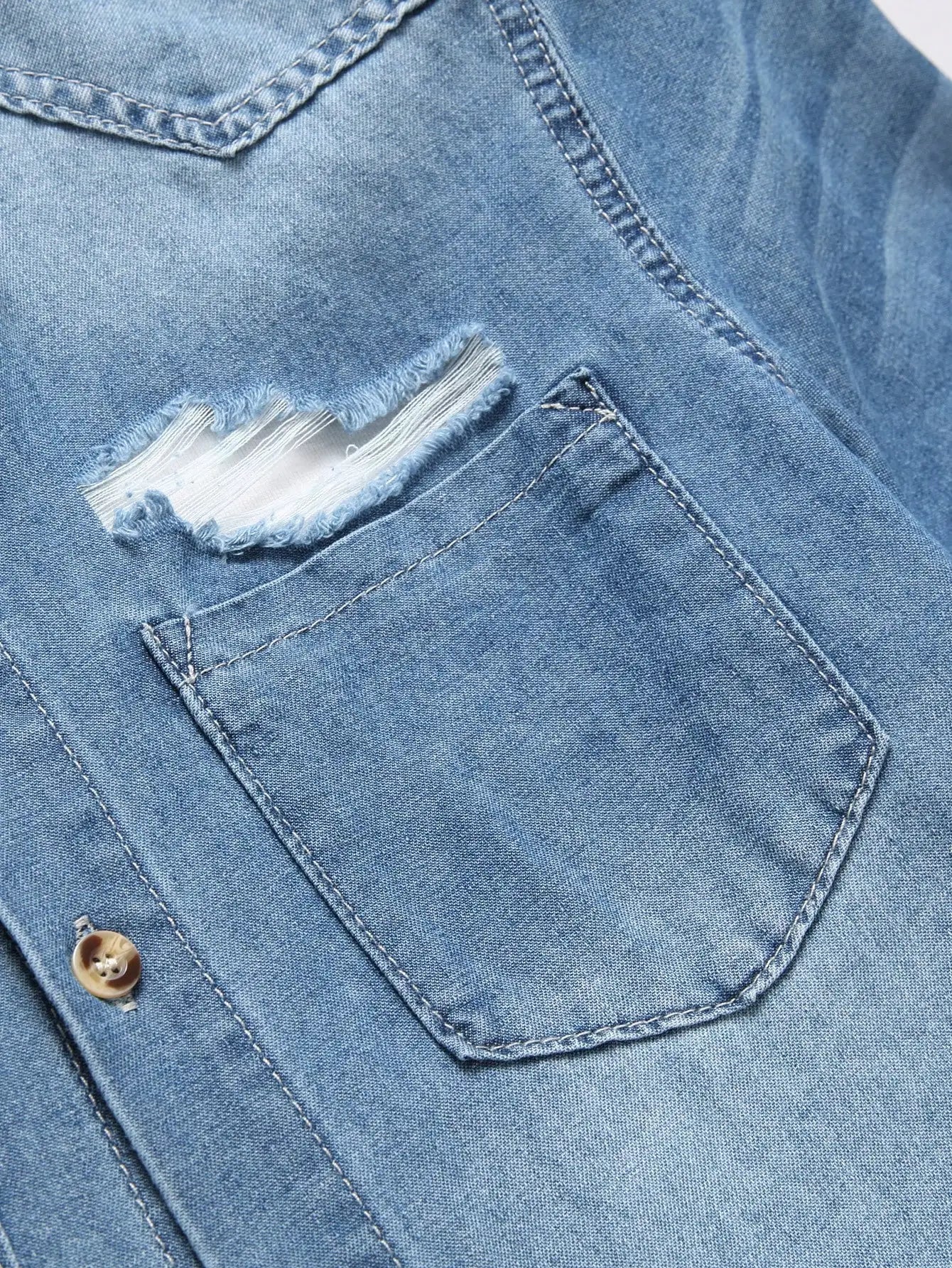 Men's summer blue short - sleeved denim shirt with ripped details. The ripped design elements showcase a trendy and casual style
