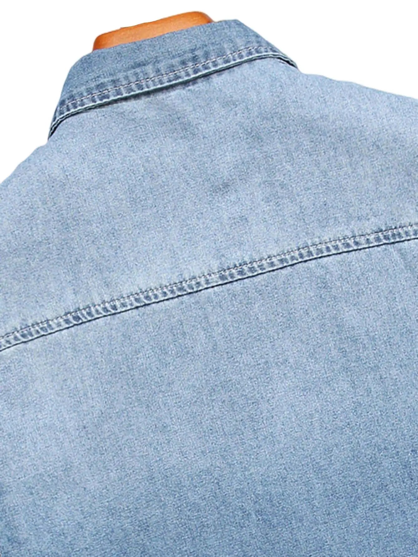 Men's summer blue short - sleeved denim shirt with ripped details. The ripped design elements showcase a trendy and casual style