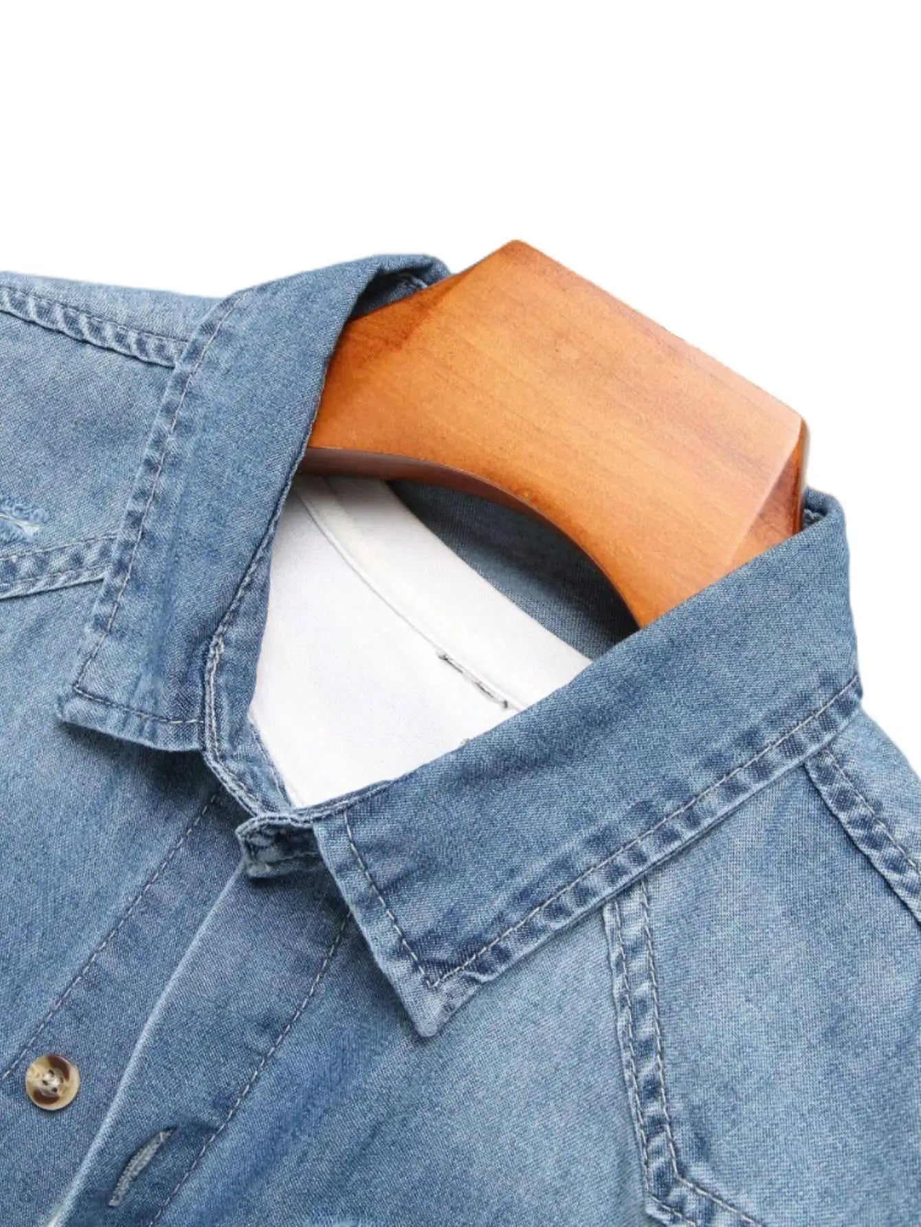 Men's summer blue short - sleeved denim shirt with ripped details. The ripped design elements showcase a trendy and casual style