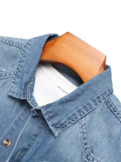 Men's summer blue short - sleeved denim shirt with ripped details. The ripped design elements showcase a trendy and casual style